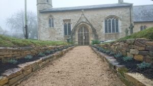 Planting lavenders and allium bulbs at a church in Fifield