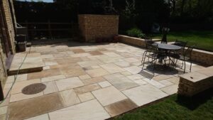 A new patio with cotswold stone walling in Great Rollright