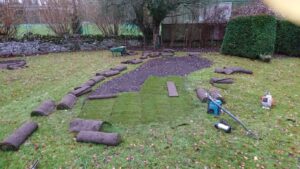 Turfing over flowerbeds in Shipton Under Wychwood
