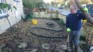 Installing flowerbeds into a front garden High Street Finstock to our clients design